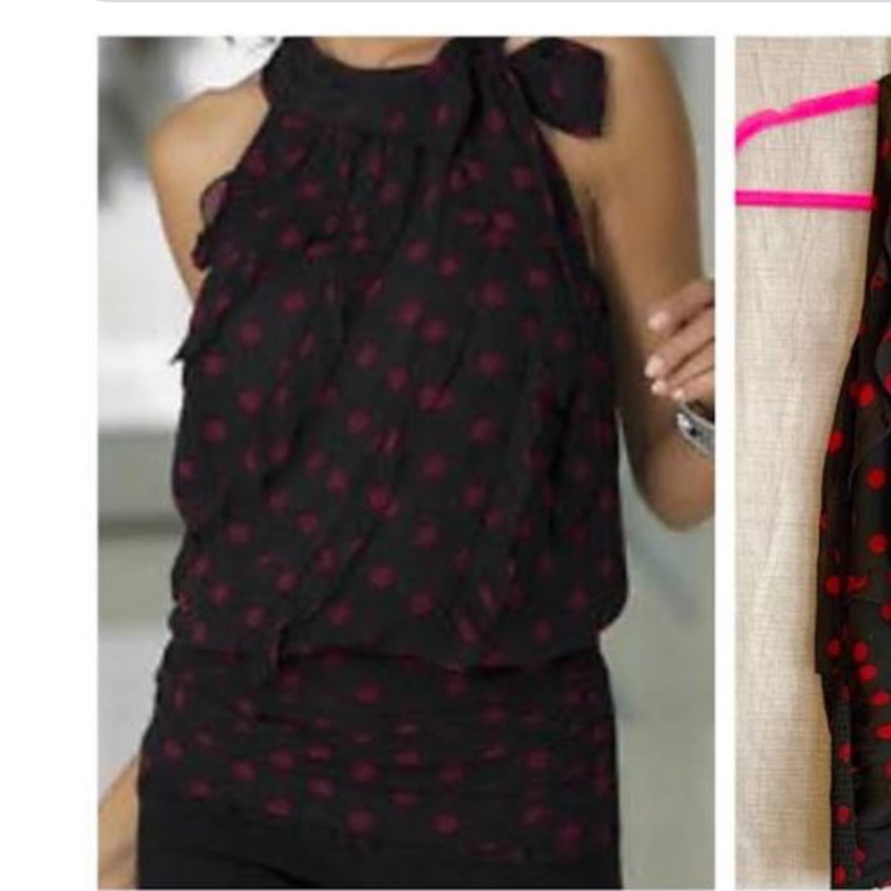 Red polka dot blouse with ruffle detail.